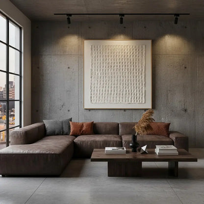 Modern living room with a brown sectional sofa, wooden coffee table, and abstract wall art.